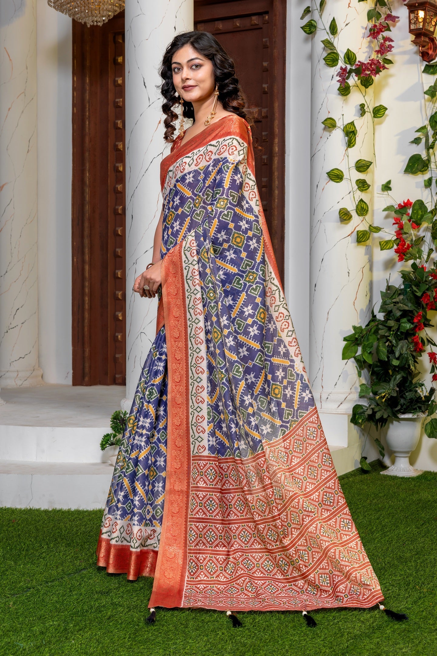 Indigo Radiance: Elegant Patola Print Art Silk Saree with Zari Border