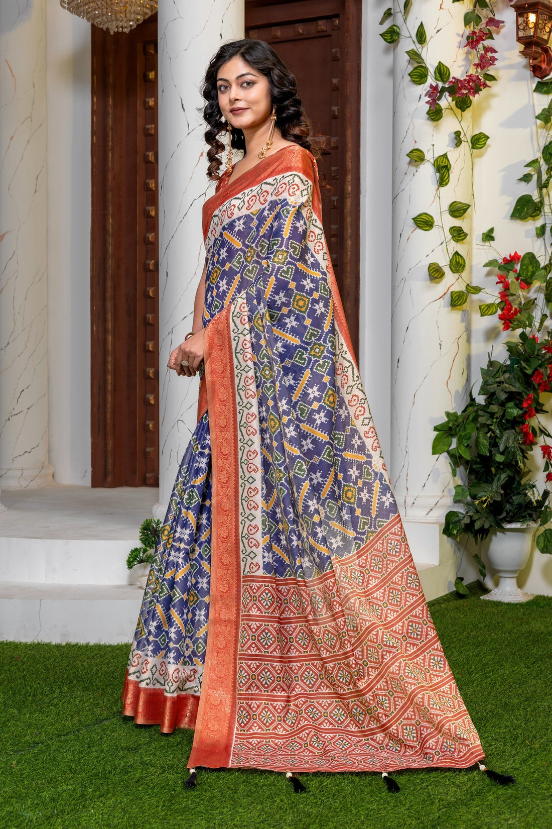 Indigo Radiance: Elegant Patola Print Art Silk Saree with Zari Border