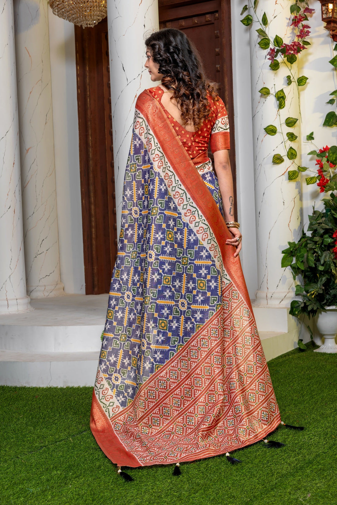 Indigo Radiance: Elegant Patola Print Art Silk Saree with Zari Border