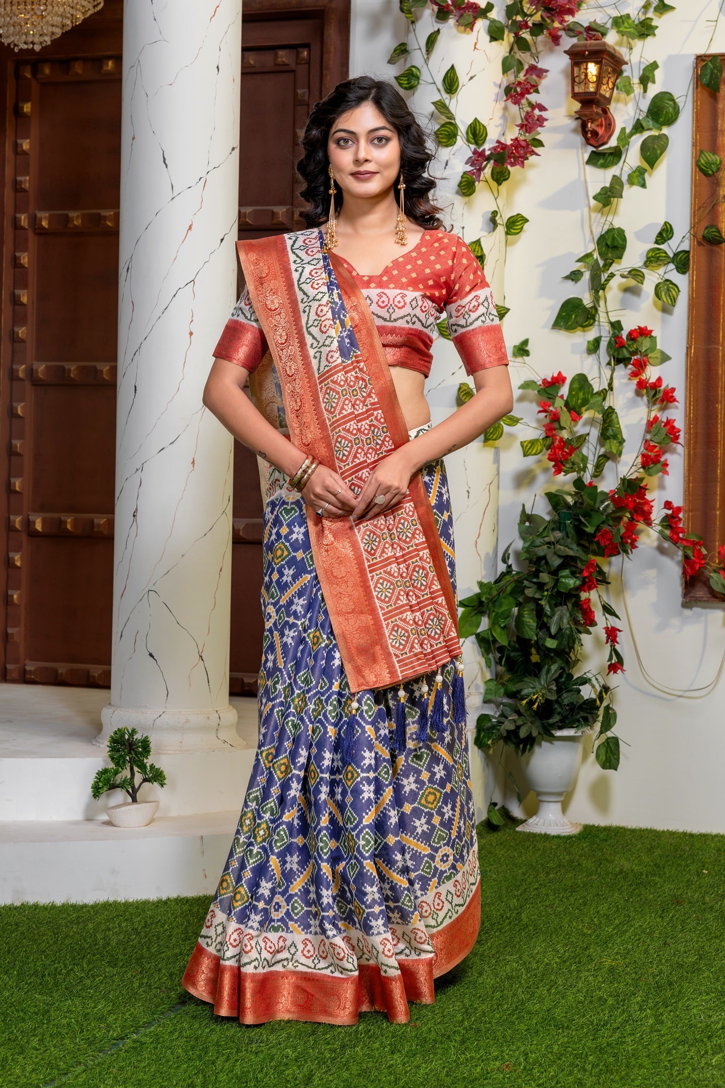 Indigo Radiance: Elegant Patola Print Art Silk Saree with Zari Border