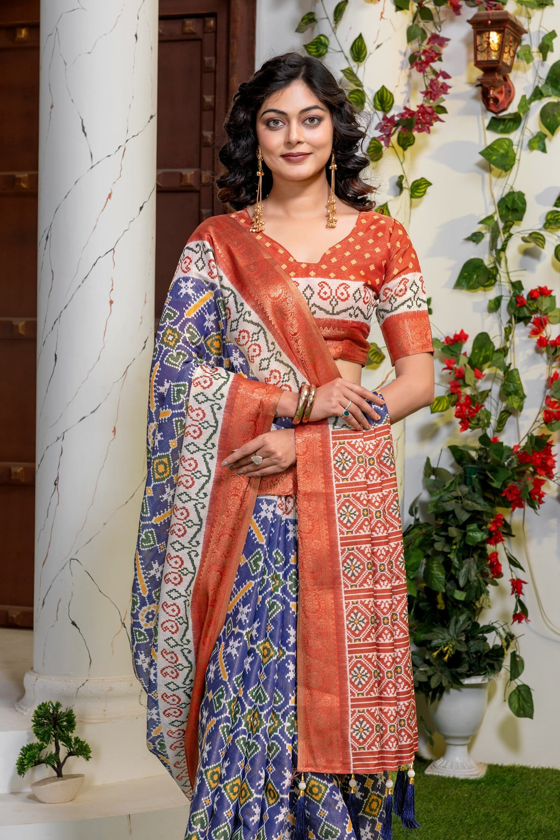 Indigo Radiance: Elegant Patola Print Art Silk Saree with Zari Border
