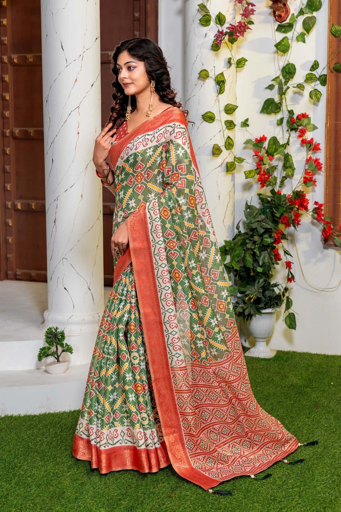 Vibrant Green Patola Silk Saree with Elegant Zari Border