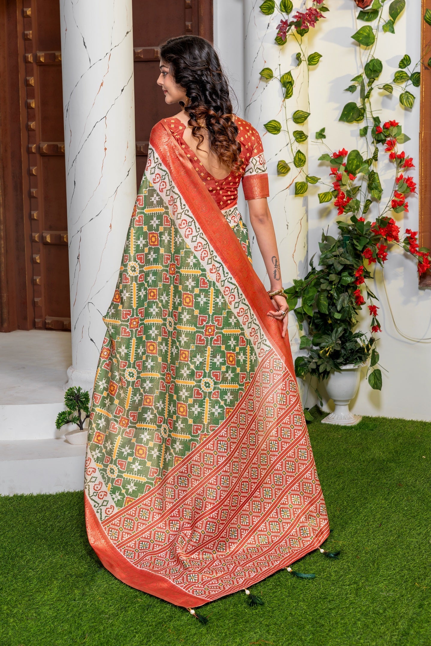 Vibrant Green Patola Silk Saree with Elegant Zari Border