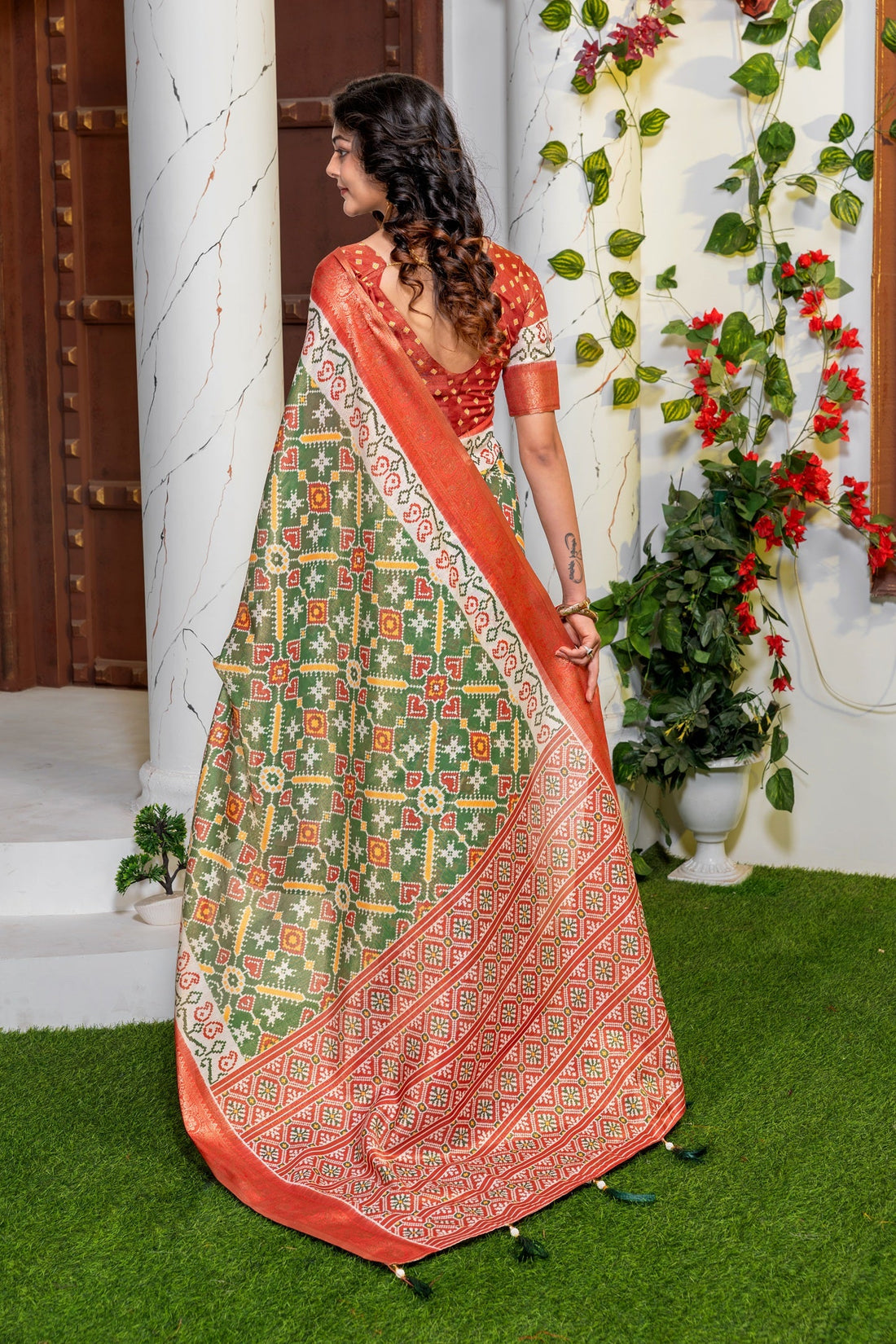 Vibrant Green Patola Silk Saree with Elegant Zari Border